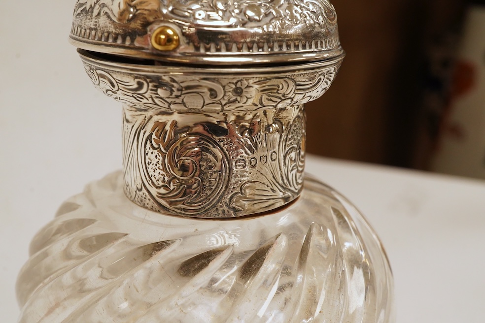 A George III silver helmet shaped cream jug, London, 1796, 14.7cm, together with two silver topped glass scent bottles, one Victorian, a pair of late Victorian silver dwarf candlesticks, London, 1895, a silver mounted ha